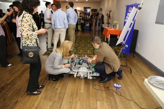 A Team 5016 member explains one of the team’s robots, "Sherman", during the team's fundraiser event at LaunchPad of Huntington. Thank you to LaunchPad of Huntington for supporting us and allowing us to use their venue and to all of the sponsors for supporting Team 67 so that we can continue to inspire the next generation of problem solvers.